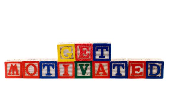 The words get motivated, spelled using colorful baby blocks, isolated against a white background