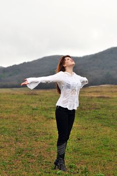 sweet redheaded girl pulling towards to rain
