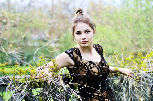 tree-bound attractive girl standing near the wall
