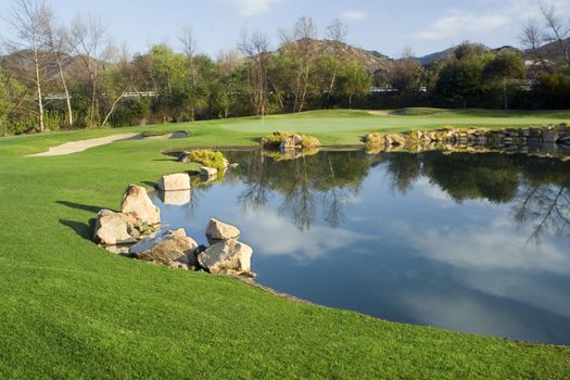 Golf Green and Lake on a Beautiful Morning.