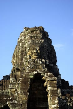 It's a view of one tower of the Bayon temple in Angkor