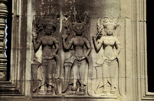 It's a close-up of an engraved stone with three dancing womens of a temple in Angkor
