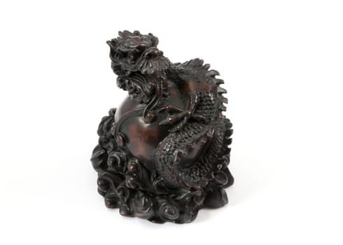 Asiatic dragon wood statue on a white background