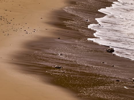 Waves crashing on the coast on a beach in Malta