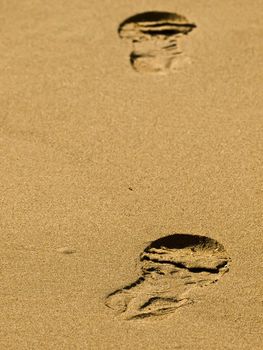 Footprint in the sand on a tropical beach