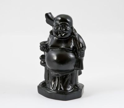 Black buddha statuette on a white background