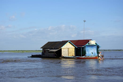 These two houses are normally here, in Cambodia, when the water come, it's a normal fact from cambodians