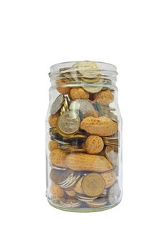 Coins and peanuts in glass jar savings for retirement isolated