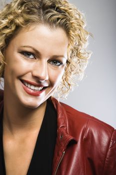 Blond Caucasian young adult woman smiling at viewer.