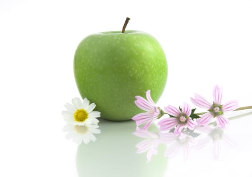 Grenn Apple with flowers and reflection