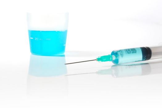 Syringe with blue liquid