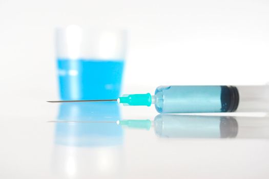 Syringe with blue liquid