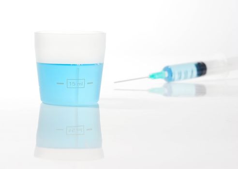 Syringe with blue liquid