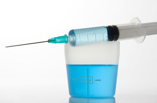 Syringe with blue liquid