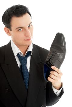 picture of salesman with black leather boot over white