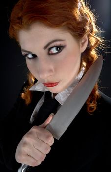 portrait of crazy schoolgirl with big knife