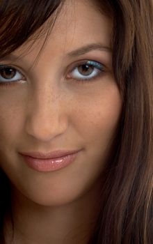 closeup portrait of smiling brunette with long hair