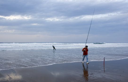 an angler fishing in the sea