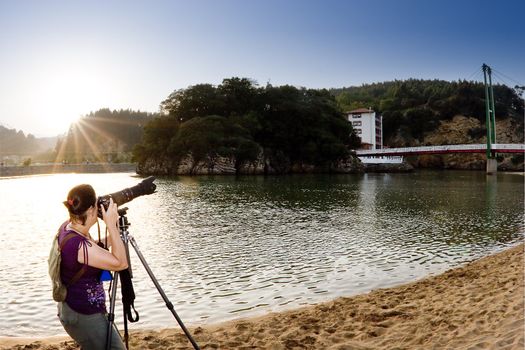 a girl making some photos in a sunny day