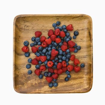 Platter of mixed blueberries and raspberries.