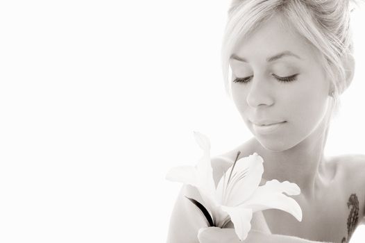 monochrome picture of pretty lady with madonna lily over white background