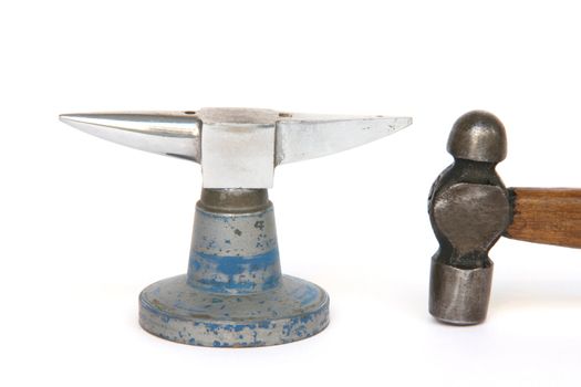 small anvil and hammer from jewelry manufacture isolated