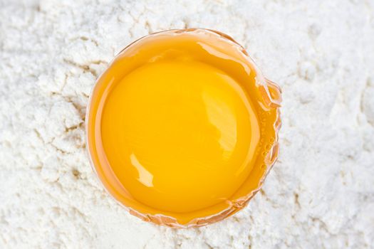 open egg on a bed of flour