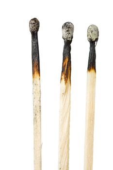 three burned matches isolated on white background