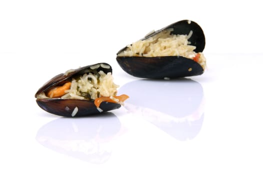 gourmet two mussels cooked with rice isolated on white background with reflection