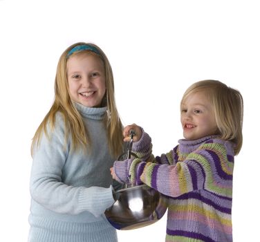 Sisters mixing and baking isolated on a white background