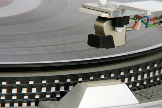 closeup of old turntable with long play vinyl