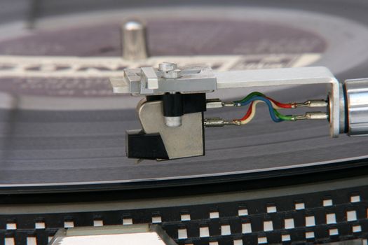 closeup of old turntable with long play vinyl