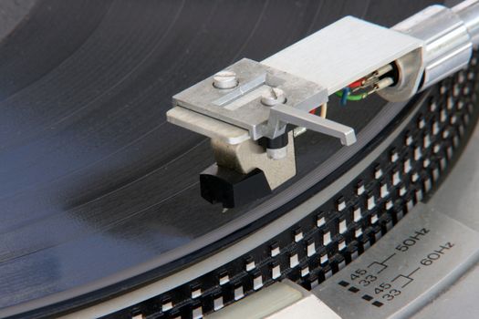 closeup of old turntable with long play vinyl