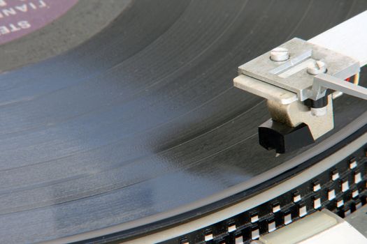 closeup of old turntable with long play vinyl