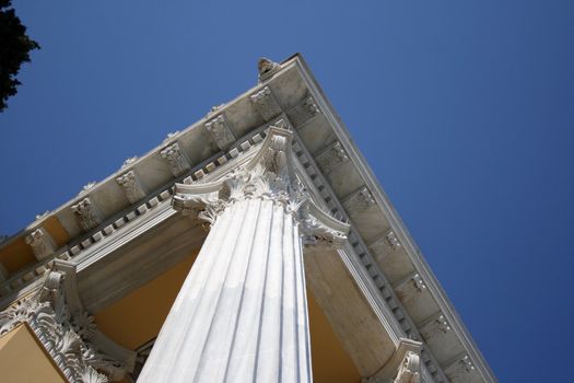 roof detail and pillars and blue sky from zapeion building landmarks of athens greece