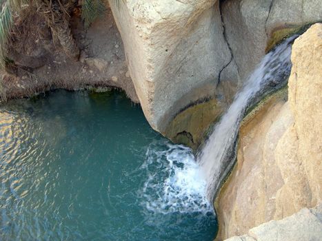 Waterfall in Oasis between the rocks tunisia africa          