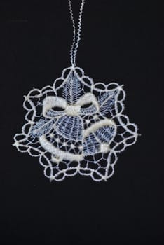 crocheted decoration in star shape showing bells