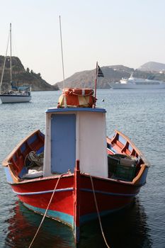small boat yacht and cruise ship moored at patmos island greece