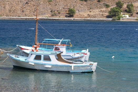 traditional greek fishing boats at harbor