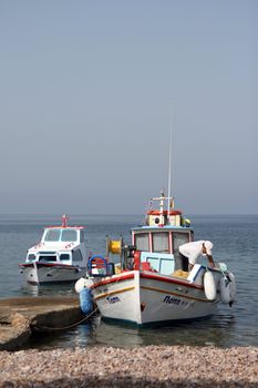 fisherman on boat   moored at patmos island greece