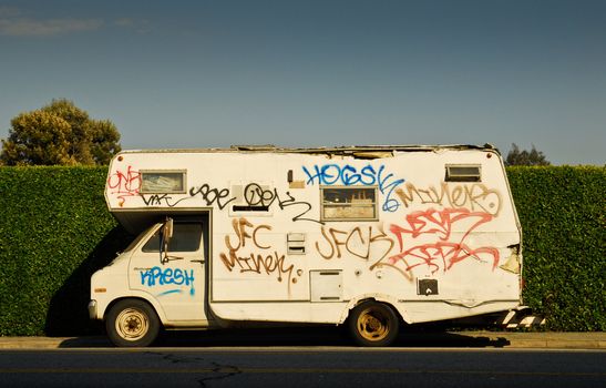 side view of graffiti covered motorhome