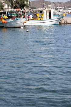 sea and fishing boats moored at patmos island greece