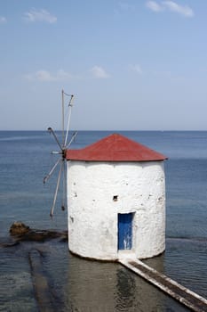 floating white water mill in the sea Leros island dodecanese greece