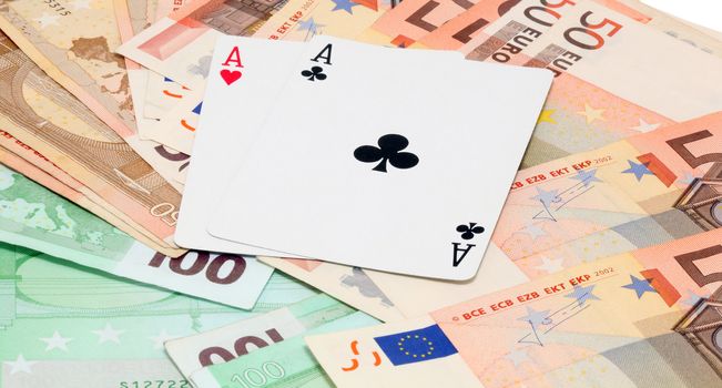 two aces gambling and money with euro banknotes background