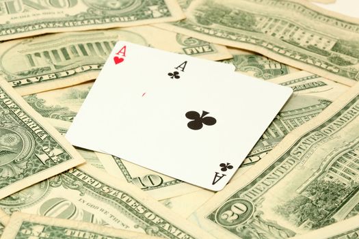 two aces gambling and money with american dollars banknotes background