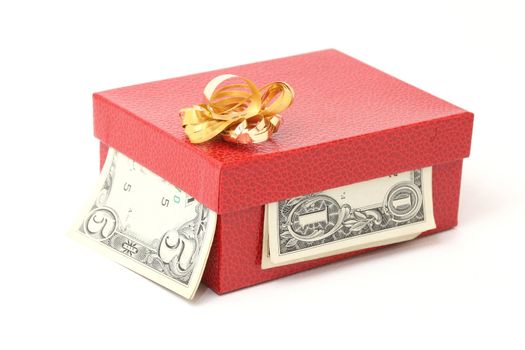 expensive red gift box with gold bow and dollars isolated