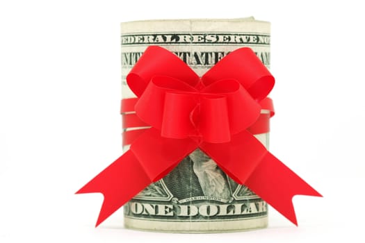 roll of dollars with red ribbon bow isolated