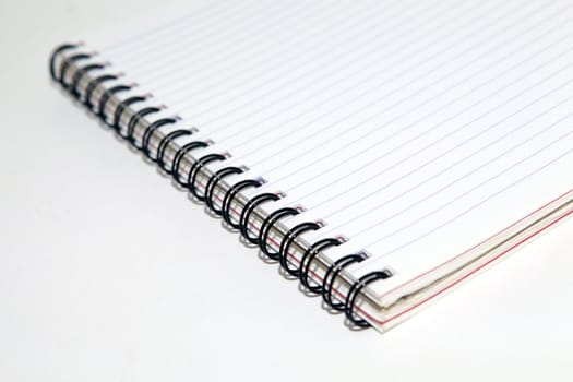 business objects closeup detail of spiral notepad with copyspace