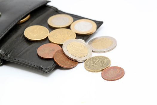 detail of euro coins out of black leather wallet isolated