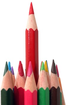 long red pencil and colorful pencils closeup detail isolated with copyspace